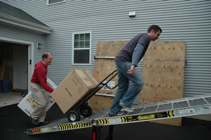 Carrying a load up the loading ramp into the trailer in Maryland